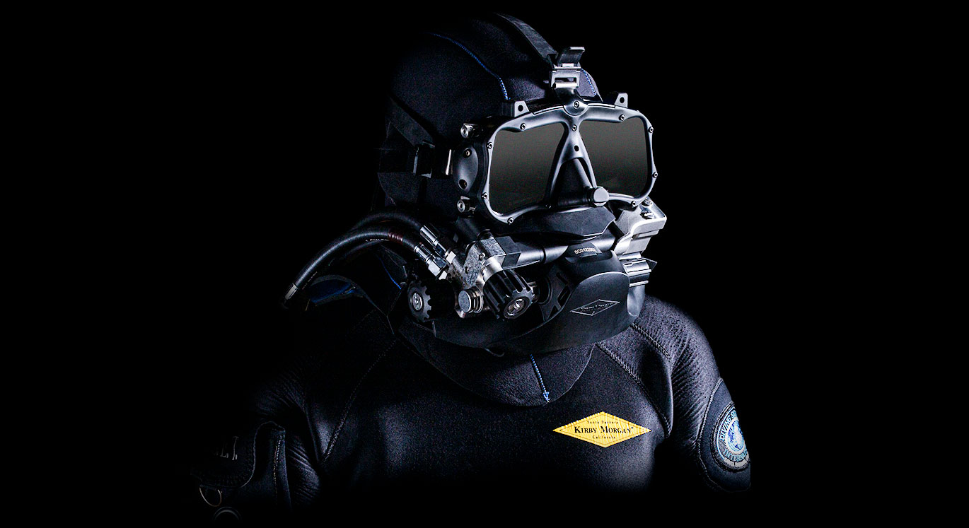 Kirby Morgan Mask in use at km for tough work. Diving with air from the  surface (replacement of copper diving helmet). Introduced in 1987 at km.  Possible to switch to Bail Out (